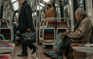 Poor man in subway