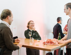 photo of three people talking together